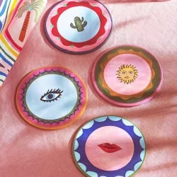 All 4 colourful Eleanor Bowmer Electric Coast Icon round placemats showing the cacti, eyes, lips and sun designs