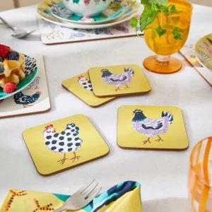 Chick Chicken Set of 4 Coasters by Ulster Weavers on dining table with glass